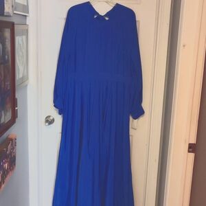 Floor length dress with drama in the details.